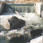 A river flows freely in early Manitoba spring