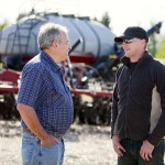 farmers talking in a field