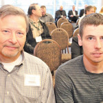 The late John Smith (l) of Seed Depot and his son Walter at the 2015 Prairie Recommending Committee for Wheat, Rye and Triticale (PRCWRT) after two of Seed Depot’s varieties — Faller and Prosper — were recommended for interim registration. Both varieties, along with FP Genetic’s Elgin ND, were recommended for full registration at the PRCWRT meeting last week. John Smith started working on Faller’s registration in 2012, but passed away Sept. 3, 2015, before seeing his efforts rewarded.
