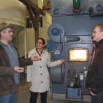 Andy Martin (l) of Providence College discusses cattail biomass with Dimple Roy (c) and Richard Grosshans (r) of the International Institute for Sustainable Development.
