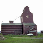 A grain elevator in Winnipegosis, on the now-abandoned Winnipegosis line of the Canadian National Railway, has a capacity of 85,000 bushels. Once operated by the National Grain Company, the elevator now appears to be unused. 