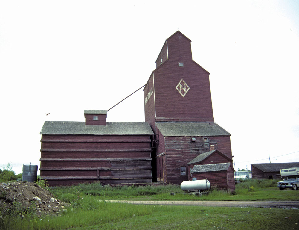 A grain elevator in Winnipegosis, on the now-abandoned Winnipegosis line of the Canadian National Railway, has a capacity of 85,000 bushels. Once operated by the National Grain Company, the elevator now appears to be unused. 