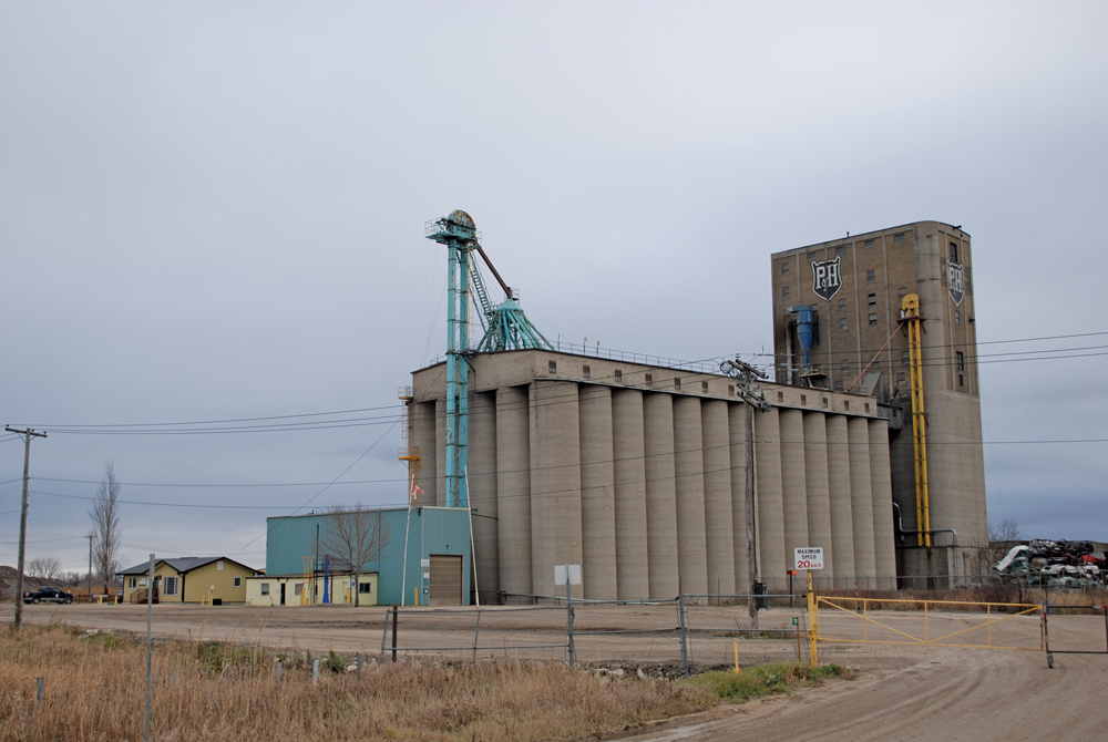 A transfer elevator in the RM of Springfield was constructed in 1912 for the Canadian Pacific Railway. Its 108 concrete silos could store up to one million bushels of grain arriving from across the prairies. Over a period of 12 hours on 18 October 1913, the annex sank into the ground until it listed at an angle of 30 degrees. A new foundation to bedrock was constructed under it, and the annex was re-straightened. The elevator was purchased in 1970 by Parrish & Heimbecker. 