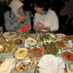 Two Syrian women, in better times, partake of a celebratory
feast of the rich and varied local cuisine after a workshop on
constructed wetlands in Damascus.