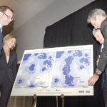 Premier Brian Pallister (r), Wade Oosterman, Pat Solman and Chris Goertzen examine a map of Highway 75.