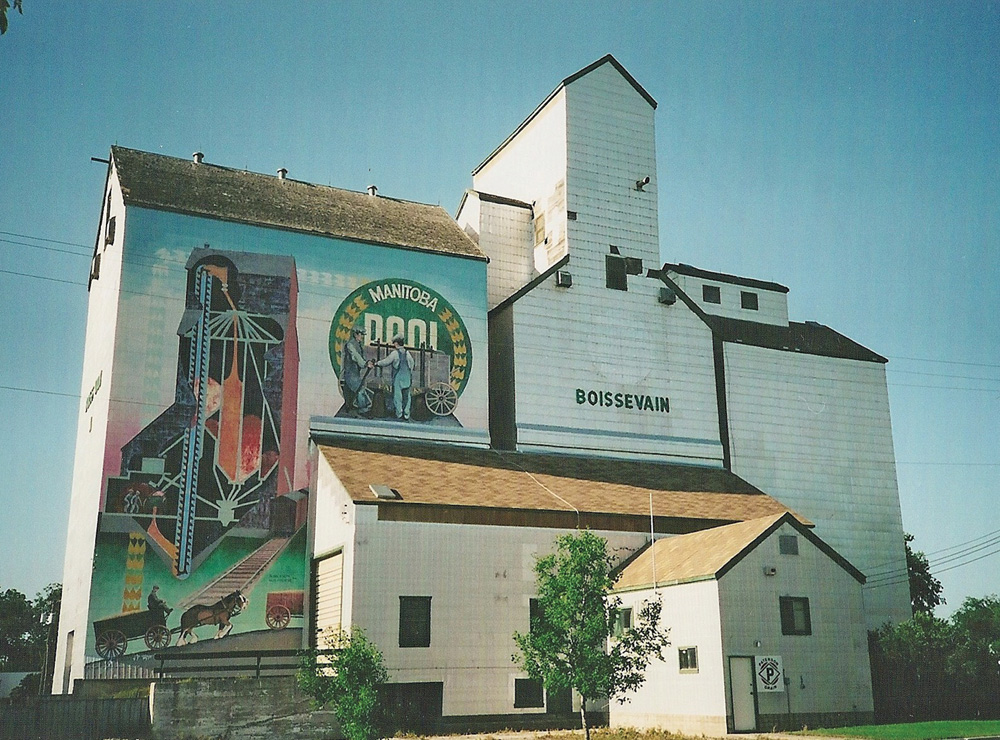 A Pool elevator and annex on South Railway Street in Boissevain features a large, colourful mural painted in the 1990s by artists Stephen Jackson and Gus Froese.