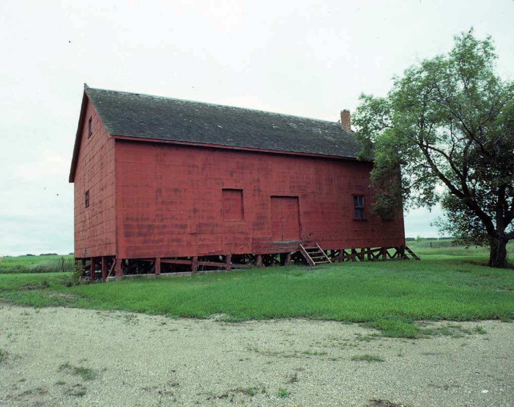 A small unassuming building in Brookdale is believed to be one of only two surviving examples of a flat grain warehouse in Manitoba. Before the advent of tall elevators, warehouses such as these were used to store sacks of grain. Constructed in 1902, it was later acquired by Manitoba Pool Elevators around the time that it constructed an elevator nearby. When a local farmer purchased the elevator after it closed in 1978, he purchased this warehouse too.