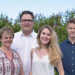 Cal and Cathy Penner, with their children Nikki and Eric, have been named the 2016 Red River Ex farm family of the year.