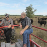 Bison producer Ken Overby (l) and Ralph Eichler, provincial agriculture minister, talk a bit about bison production Sept. 18 as part of Open Farm Day.