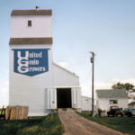 Constructed in the summer of 1938, a wooden elevator at Rignold (formerly Ridgeway) on the CNR Gladstone Subdivision, in the Rural Municipality of Portage la Prairie, was operated by United Grain Growers. An annex was added to it in 1955, bringing its total capacity to 82,000 bushels. The facility is believed to have been demolished sometime after 1994.