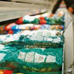 packed frozen food in a freezer in a supermarket