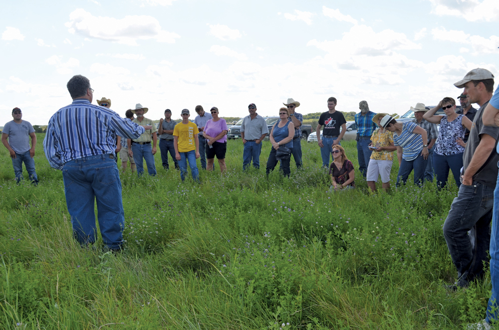 Larry Wagner, a Virden-area producer discusses his management strategies in a pasture on his operation last summer.