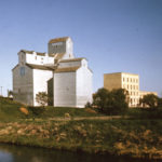 Between 1881 and 1883, the Glenwood Roller Mills was built on the bank of Plum Creek in Souris by entrepreneurs George McCulloch and William Herriot. The facility included a grain elevator and annex in addition to the flour mill. The mill closed in 1921 due to the economic depression that followed the First World War. Purchased by the McCabe Grain Company in 1938, the firm constructed a new grain elevator in 1961. The facility was bought by United Grain Growers in March 1968. Closed around 1995, the old plant was demolished in June 1996.