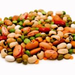 Dried legumes and cereals on a white background