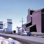 At the time of this 1962 photo, Brunkild had three grain elevators, one operated by United Grain Growers and two by Manitoba Pool (A at left, B in the middle). The UGG agent was G. A. Angus while the Pools were managed by Gene Ferens (A) and Joseph Storey (B). Only the Pool A elevator survives today, in use by BESCO Grain.