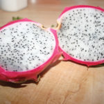 Try an unusual fruit, such as dragon fruit. It’s bright pink with green spines on the outside and white with tiny black seeds inside.