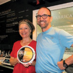 Wanting to preserve the nature of their farming business and safeguard their family heritage, Suzanne Dufresne and Daniel Gosselin display one of their cheese varieties produced in their cheese-making facility built on their farm to add value to their milk.