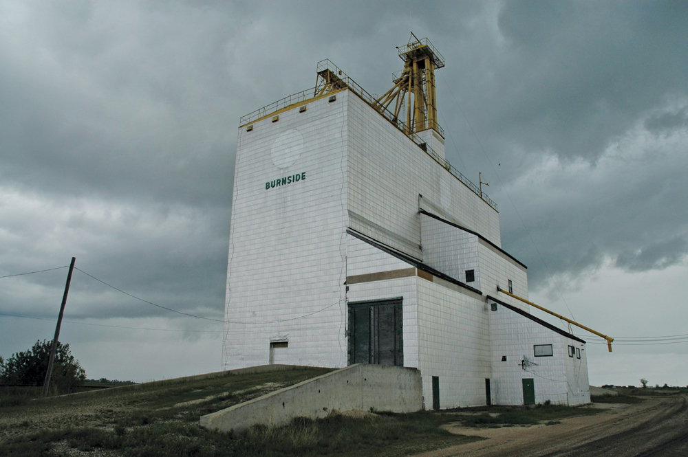 A 185,000-bushel grain elevator at Burnside Siding, on the CPR Carberry Subdivision near the junction of the Trans-Canada Highway and the Yellowhead Highway in the RM of Portage la Prairie, was built in early 1984 by Manitoba Pool. Seen here in 2007,  it was demolished in 2008, after just 24 years of service.
