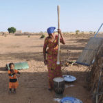 A woman at work pounding millet in Ndiael, Senegal, December 9, 2016.