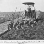 The Canadian-made Sawyer Massey kerosene-burning tractor, pulling a five-bottom 14-inch Powerlift Cockshutt engine plow at the 1916 light tractor demonstration in Brandon.