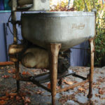 A corn husker that constantly broke down caused Frederick Maytag to vow to produce top-quality products, leading to the company's reputation for bulletproof designs like this early washing machine.