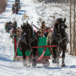 Eugene Lepischak of Rossburn, Man. and his family make their way, with 32 other sleighs, from the south side of the mountain. Lepischak had three generations of family on the sleigh.