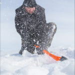 Derek Huston of Rivers widens his fishing hole, no small feat with ice measuring up to 37 inches thick in spots.