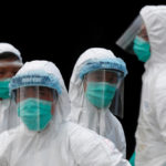 Health officers in protective clothing cull poultry at a wholesale market, as trade in live poultry was suspended after a spot check at a local street market revealed the presence of H7N9 bird flu virus, in Hong Kong June 7, 2016.