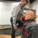 Turn on the the six-inch auger under this bin and this mannequin will be chest deep in grain in just eight or nine seconds, says Glen Blahey.