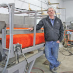 Winkler-area vegetable grower Garry Wiebe, pictured beside a specialized pumpkin washer he built on his Winkler-area farm for crops he planned to grow for CPG, says the financial hit from the company’s woes will be felt well beyond the farm gate.