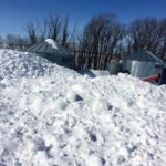 Cleanup begins in a farmyard near Killarney, Man., after a blizzard on March 7.