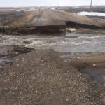 A rural road is washed out from local flooding in southern Manitoba.