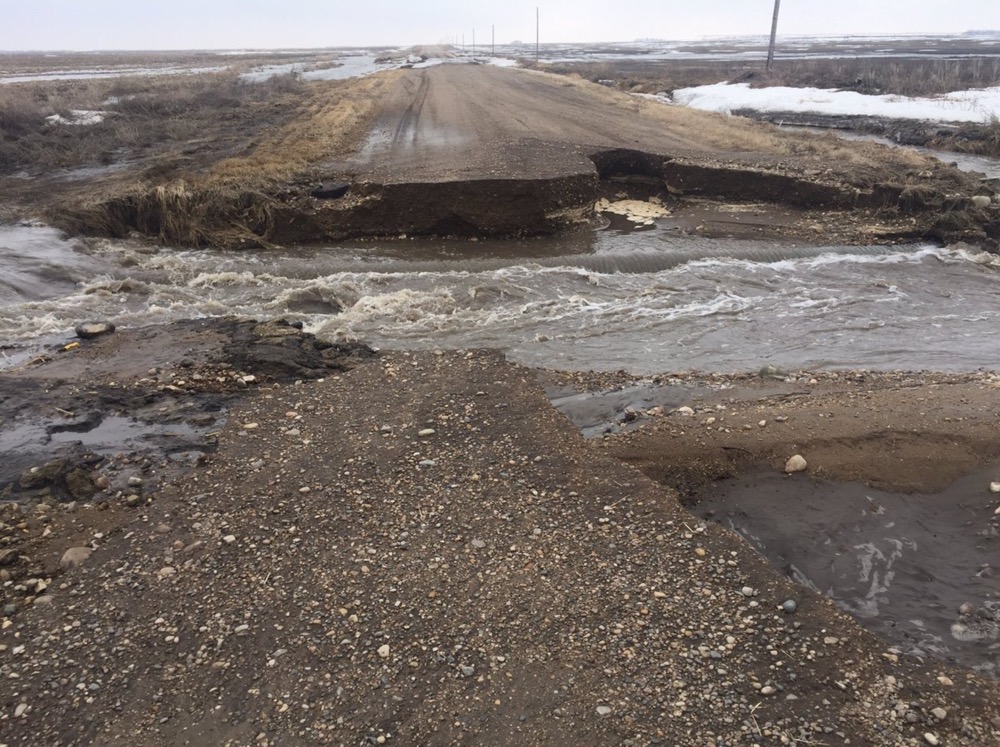 A rural road is washed out from local flooding in southern Manitoba.