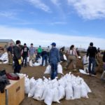 Volunteers fill sandbags near Carman after ice jams on the Boyne River caused flooding that threatened dozens of homes.