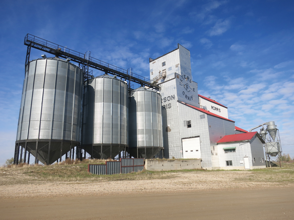 A 40,000-bushel wooden grain elevator at Morris was built by Paterson Grain around 1940. A crib annex was built beside it in 1952,  and three steel tanks were added later. After a large terminal elevator was built on the south side of town, use of the facility diminished and it was finally demolished in April 2017.