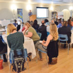 About 40 economic development officers from rural communities listen to economist John Harper speak on what’s to come in 2017.