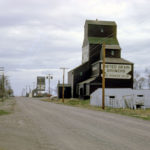 As we see in this photo from 1962, United Grain Growers once had three elevators at Griswold. The oldest, a squat 28,000-bushel elevator acquired from Ogilvie Milling, was known as #3 and it stood next to the 47,000-bushel #2 elevator, also a former Ogilvie facility. In the background was the 78,000-bushel #1 elevator built in 1940 using materials salvaged from several demolished elevators. A crib annex was added to #1 around 1954. Available records suggest a single agent managed all three elevators, and there were only three UGG agents at Griswold between 1912 and 1985. The old #3 began to lean over the railway track so it was demolished in 1980. The two remaining elevators closed in 1996 and were later removed from the site.