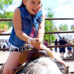 Patience Bruce of Brandon takes a turn in the saddle during the Manitoba Summer Fair June 7-11.