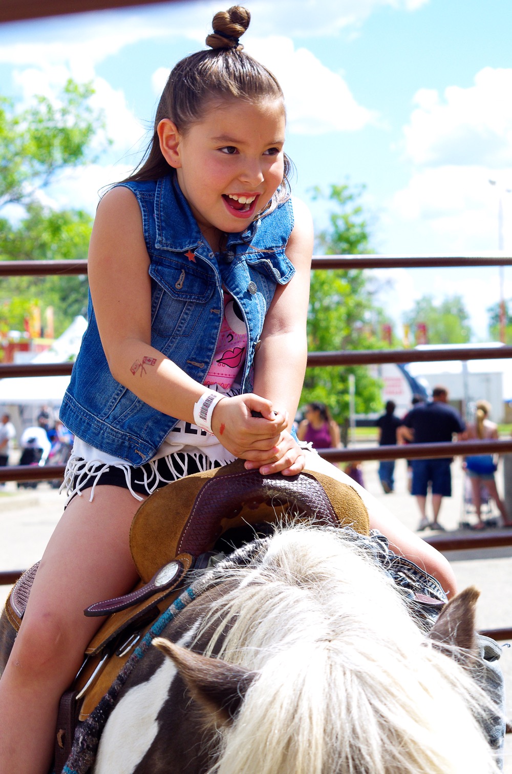 Patience Bruce of Brandon takes a turn in the saddle during the Manitoba Summer Fair June 7-11.