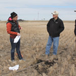 Manitoba Agriculture land management specialist Marla Riekman (l), and farmer Doug Wilton and his son Andrew discuss the ‘soilyourundies’ demonstration in one of Doug’s zero-till fields near Roland, Man. April 18.