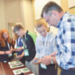 Delegates try out the recently released Weedscout app during the Global 4-H Summit in Ottawa July 11-14.