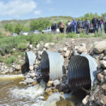 Aquanty tour attendees make a stop at one of several water control structures in the Assiniboine-Birdstail Watershed June 21. The watershed was the focus of some of the first scenarios run through the MFGA Aquanty hydrological model.