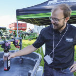 Matt Kynoch, solutions supply specialist with Enns Brothers, demonstrates a worn spray nozzle at the June 22 Canolapalooza event in Portage la Prairie.