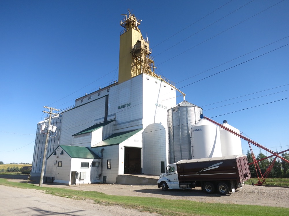 A former Manitoba Pool elevator at Manitou was built between February and September 1988, replacing two elevators at the site, a 62-year-old crib moved here from Kaleida in the fall of 1965, and a former Ogilvie Milling elevator. Joining a 100,000-bushel annex constructed in 1977, total capacity of the new facility was 143,400 bushels. In 2005, its adjacent railway was to be abandoned by
the CPR. The line between Manitou and Killarney could not be saved but, just as rail removal between Manitou and Morden was to commence in late 2008, a group including local farmers successfully established a short line railway to continue servicing the elevator, now owned and operated locally, along with producer-car loading sites at Binney, Manitou, and Darlingford.
