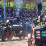 A full house under the shade of the grandstand as they watch some of the classic steam engines rumble by doing the daily Pioneer Power Parade.