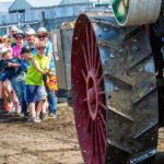 A daily challenge is crowd participation in a Tug of War with a steam engine. Can you guess who wins?