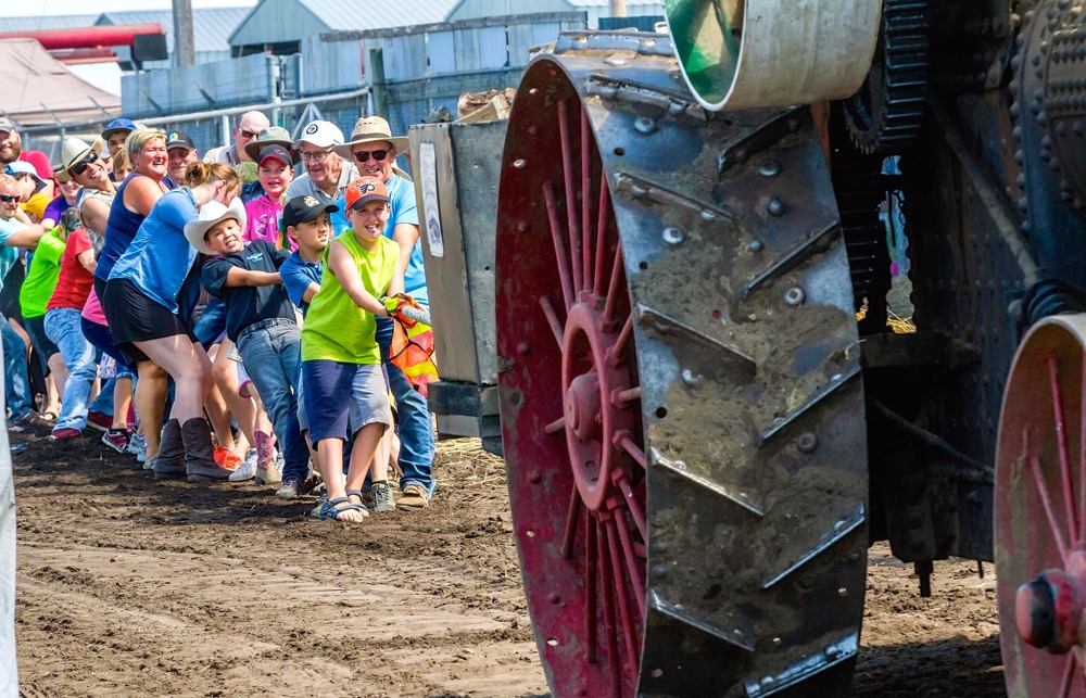 A daily challenge is crowd participation in a Tug of War with a steam engine. Can you guess who wins?
