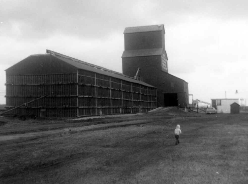A 30,000-bushel wooden grain elevator at Curtis, in the Rural Municipality of Portage la Prairie, was built in 1938 by Portage businessman Andy Forsythe. His Forsythe Elevator Company was one of the first companies west of Winnipeg to use grain-drying equipment. He introduced a fairer method for determining dockage, and successfully challenged the Canadian Pacific Railway over its blockage of highway rights-of-way, resulting in revised railway practices that are still in place today. Sold to Reliance Grain in 1946, the Curtis elevator was resold to Manitoba Pool in 1948 and a large balloon annex was built beside it in 1951. The elevator closed in July 1972 and was removed from the site.