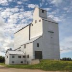 This 51,500-bushel grain elevator in Ethelbert, once located on the CNR Cowan Subdivision, was built by the Manitoba Pool Elevators in 1967. A 110,000-bushel crib annex was built beside it in 1975. The railway stopped using the line in October 1998 and, after protracted negotiations with the community broke down, in 2000 the line was sold to a Brandon firm and the tracks were removed. Agricore closed its elevator and, two years later, it was sold to a group of five local farmers. The facility is still used for private grain storage.