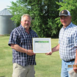 Allan Martin (l) presented the award to Metro Belbas for his 30-plus years of weather reporting.